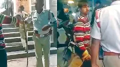 పోలీసులపైకి పాముతో దాడిచేసిన యువకుడు(వీడియో)